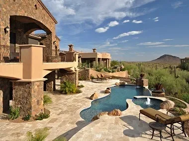 Travertine tiles and travertine pool pavers around the pool